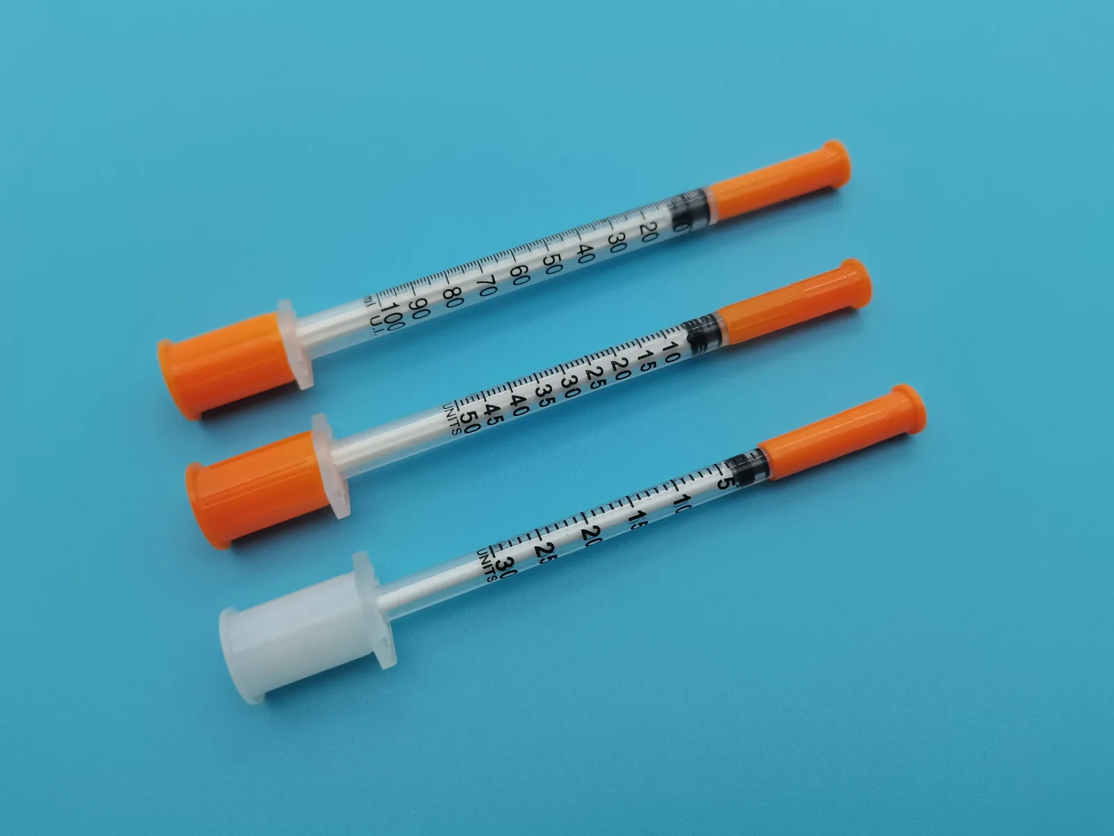 Real 100U, 50U, and 30U U-100 syringes arranged together for size comparison